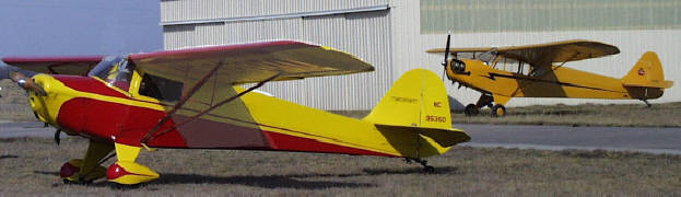Taylorcraft BC-12D in front of Piper J-3 Cub